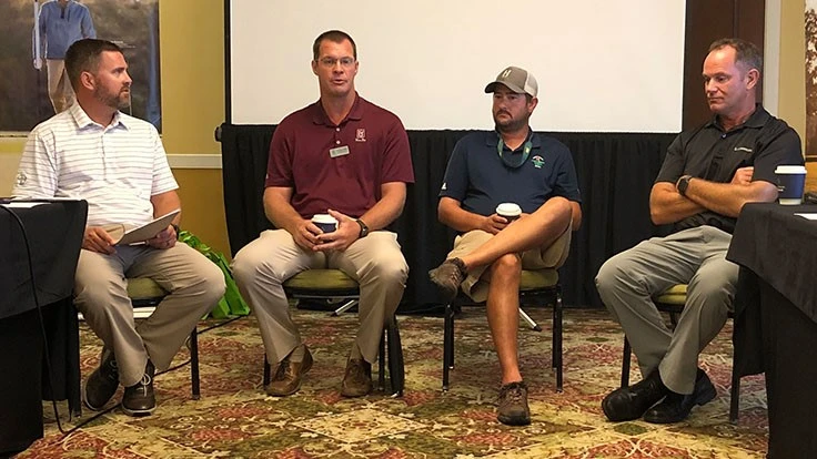 Bayer's Zach Lane talks with TPC Treviso Bay’s Gregory Jack, Misty Creek Country Club’s Preston Stephenson and Copperleaf Golf Club's David Dore-Smith.