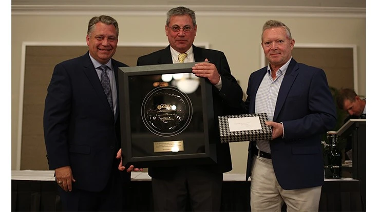 Brad Owen, from Augusta National Golf Club, with his Superintendent of the Year award from the Georgia Golf Course Superintendents Association presented by Rocky Dreibrodt, left, and Alan Corbin, right, from Corbin Turf and Ornamental Supply.