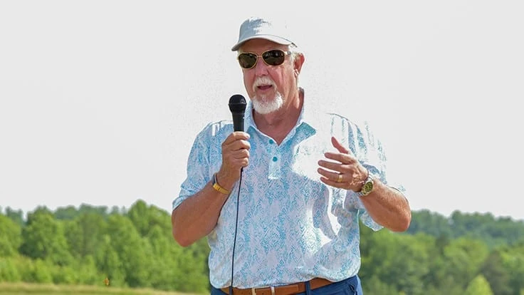 Architect Tom Clark speaks at a grand opening ceremony at Cutalong Lake Anna.