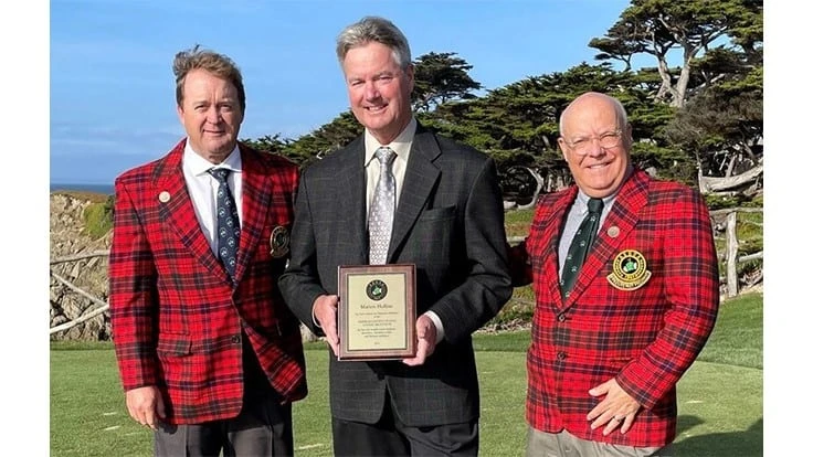 ASGCA members Brian Costello (left) and Forrest Richardson (right) present Tony Grissim, the nephew of Marion Hollins, with an Honorary Member plaque during a ceremony Nov. 9 in California.. 