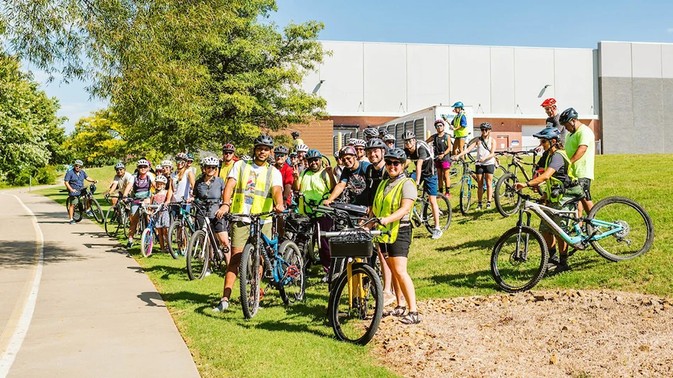 To promote low-carbon travel, fans rode bikes to Pinnacle Country Club for the 2023 Walmart NW Arkansas Championship.