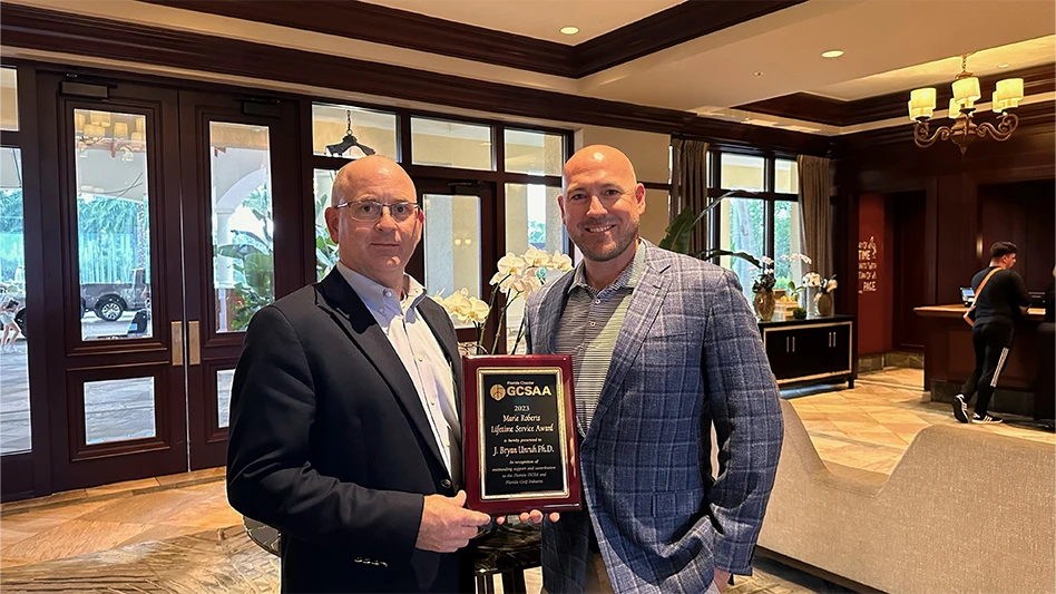 Dr. J. Bryan Unruh (left) is the Florida GCSA's Marie Roberts Lifetime Service Award recipient.