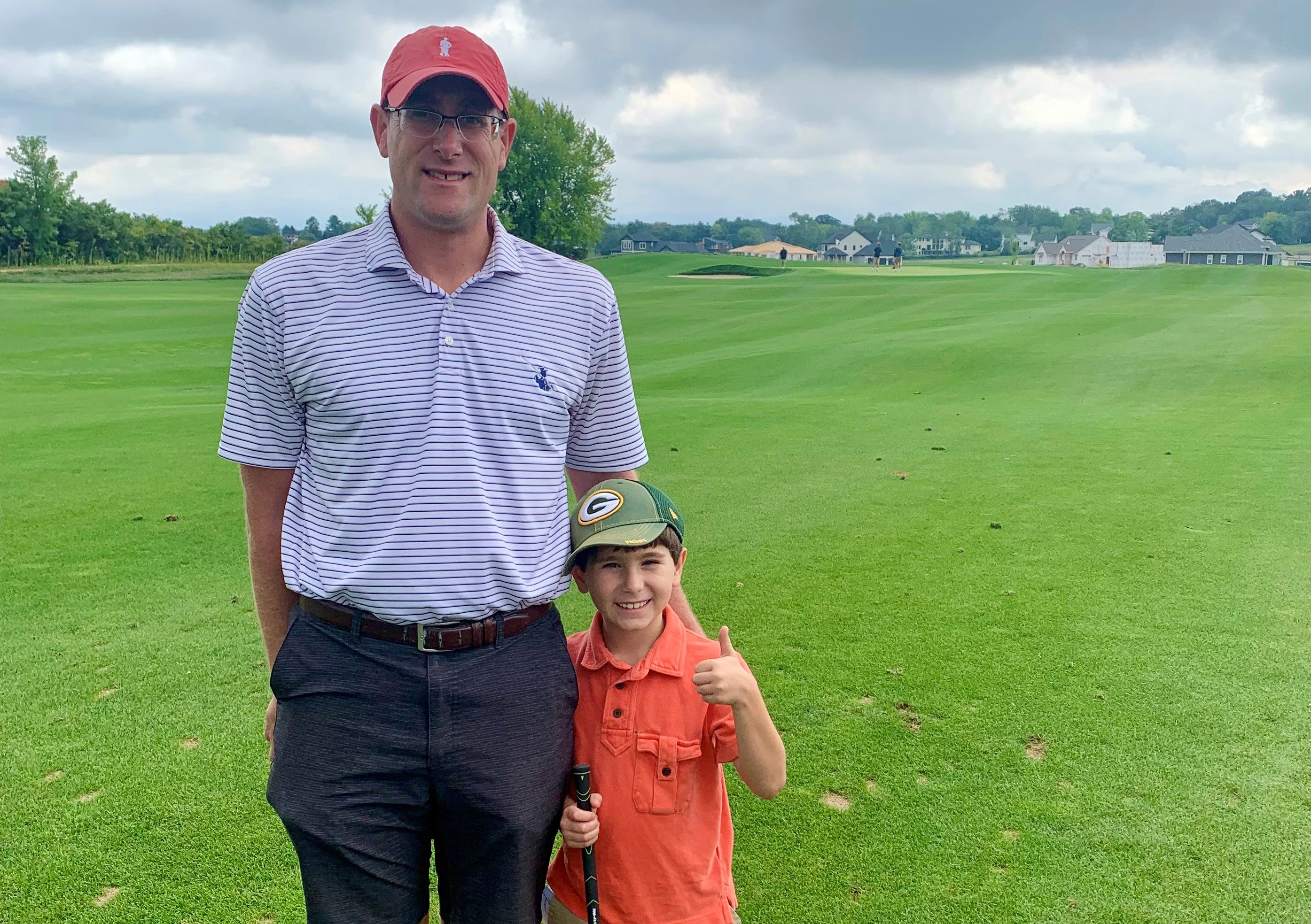 Golf Course Industry publisher + editor-in-chief Guy Cipriano, left, with his nephew, Bowen Williams, at Pioneer Pointe in Verona, Wisconsin. Pioneer Pointe is one of more than 400 golf courses Cipriano has visited in his decade with Golf Course Industry.