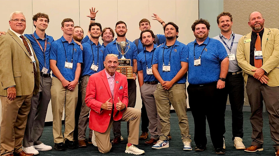 The Horry Georgetown Technical College student turf bowl team poses with the trophy after winning their fifth consecutive Carolinas GCSA Turf Bowl.