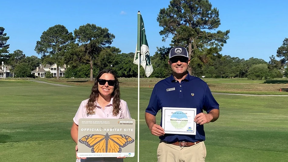 Staff poses with award
