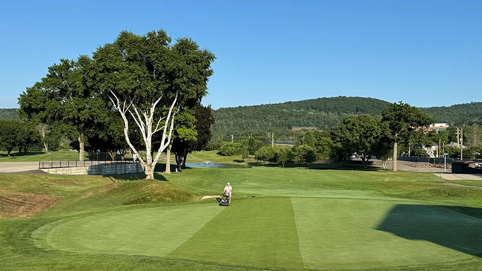 A man mowing at En-Joie Golf Club in New York