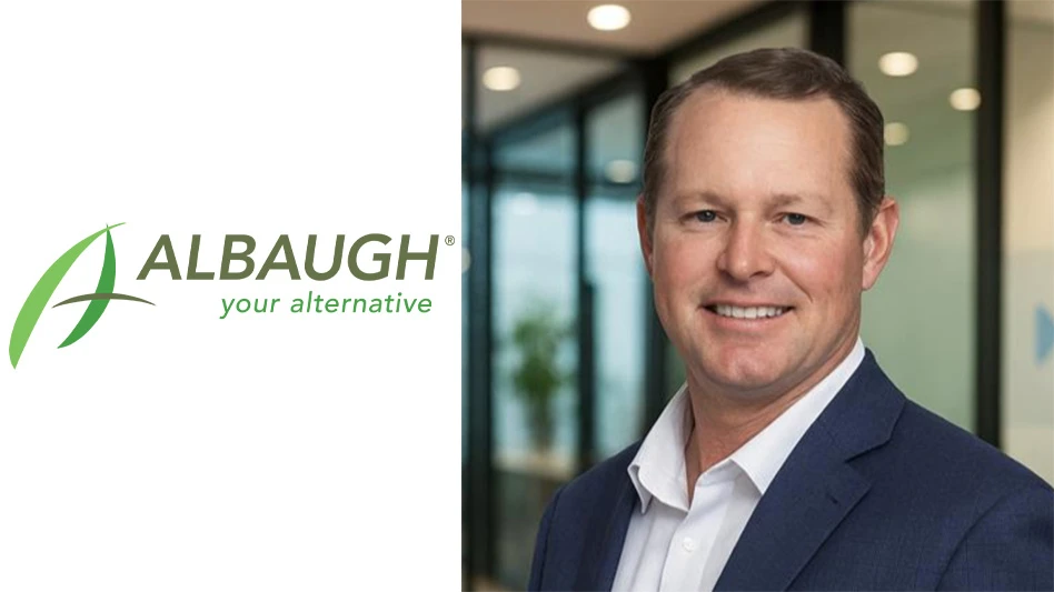 New Albaugh North American president Willie Negroni next to the company's logo