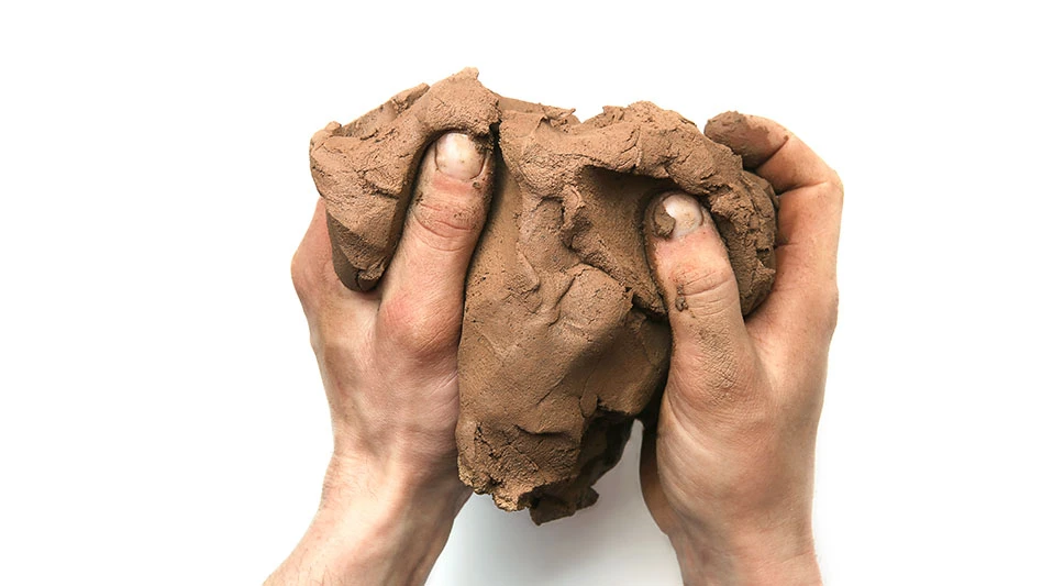 hands molding clay